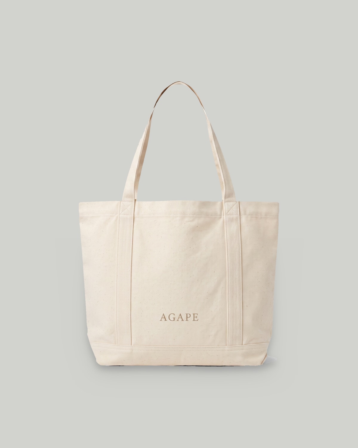Agape canvas tote on a wood bench
